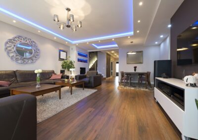 A living room with a wooden floor.