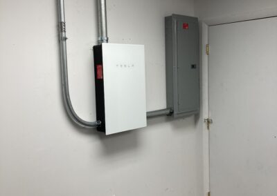 A tesla inverter in a room with a door.